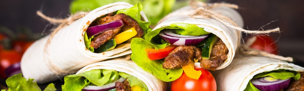 Burritos tortilla wraps with beef and vegetables